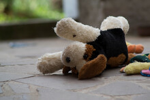 Old Stuffed Dog Lying On The Floor