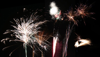Wall Mural - Row of different fireworks on a black background