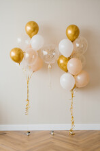 Decor For The Celebration Of The 30th Anniversary. Balloons Of Gold And White Color