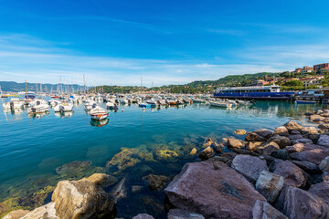 Wall Mural - Lerici port with the ferry boat station to the Cinque Terre (ferry terminal) and many boats moored, small town and tourist resort on the coast of the Gulf of La Spezia, Liguria, Italy, Europe.
