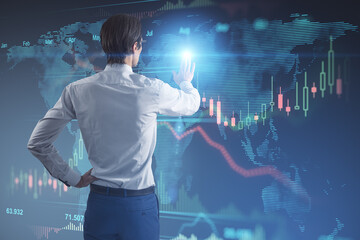 Poster - Stock market and trading concept with man back view touching digital wall screen with world map and financial chart candlestick and diagram
