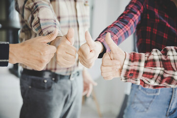 Canvas Print - young business people putting their hands together