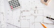 © sorapop - Architectural project workplace. Top view of house plan blueprint paper with repair tools on table desk at architecture office, Engineering architect design tools concept