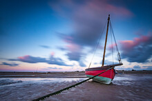 Red Boat At Low Tide
