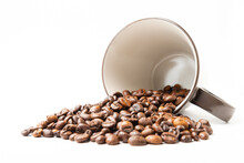 Coffee Beans In A Brown Cup On White Background. No Cutout. No Isolated.
