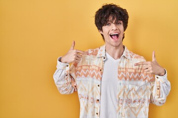 Sticker - Young man wearing casual summer shirt looking confident with smile on face, pointing oneself with fingers proud and happy.