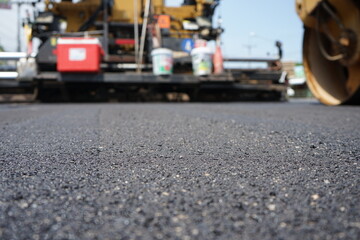 Wall Mural - The image is blurred in the construction of asphalt road.