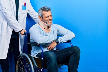 Sticker - Handsome middle age man with grey hair on wheelchair wearing cervical collar with hand on stomach because nausea, painful disease feeling unwell. ache concept.