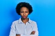 © Krakenimages.com - Young african american woman wearing casual clothes skeptic and nervous, disapproving expression on face with crossed arms. negative person.