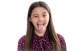 © Olena - Funny kids face. Portrait of silly teenager child girl smiling and showing tongue in camera making funny faces.