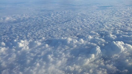 Wall Mural - Aerial view of cumulus clouds at day of summer. Beautiful cloudscape as nature background panorama. Wonderful weather of natural daylight with white cloud floating