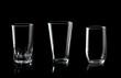 Set of empty glass of water isolated on black background