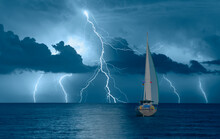 Sailing Yacht In A Stormy Weather With Thunder And Lightning