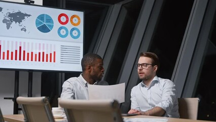 Poster - Young business colleagues discussing the financial strategy of a corporation