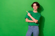 canvas print picture Photo of confident pretty lady wear spring outfit pointing empty space smiling isolated green color background
