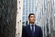 © ReeldealHD images - Asian businessman walking through city on his commute
