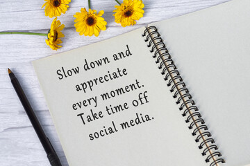 Wall Mural - Motivational quote on note book with sunflowers on wooden desk.