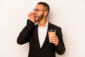 Wall Mural - Young business hispanic man holding takeaway coffee isolated on white background shouting and holding palm near opened mouth.