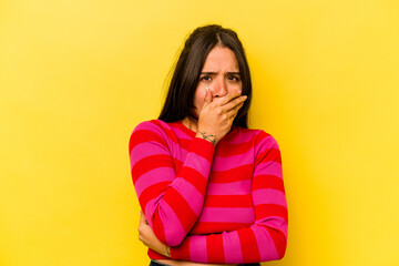 Wall Mural - Young hispanic woman isolated on yellow background scared and afraid.
