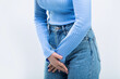 © Yevhen - Medical or gynecological problems, healthcare concept. Close up of a woman with hands holding her crotch. Woman Hands Holding Her Crotch. Sick woman hands holding pressing her crotch lower abdomen