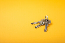 House Keys .Composition On Yellow Background.Design Element.Real Estate And Insurance Concept.Copy Space.