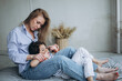 © Andreshkova Nastya - Happy family mother and daughter together have fun and huggingf at home