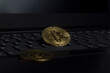 Bitcoin crypto gold coin on laptop business trading