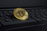 Fototapeta Miasto - Bitcoin crypto gold coin on laptop business trading