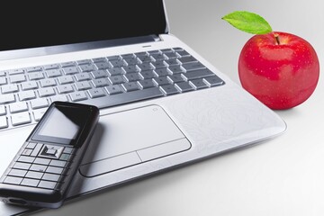 Sticker - laptop mockup with a blank screen on the desk and apple