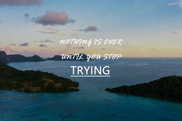 Wall Mural - Motivational and inspirational quotes - Nothing is over until you stop trying
