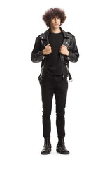 Wall Mural - Full length portrait of a young man with a curly hair in a leather jacket