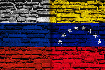 Background with the flag of Russia and Venezuela on a brick wall