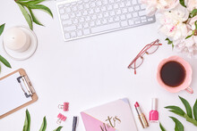 Fashion Blogger Workspace With Notepad, Glasses, Cup Of Coffee, Keyboard And White Peonies On A Light Background. Flat Lay Banner Or Shop Header, Template For Blog