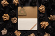 Notepad or notebook and crumpled paper balls at background texture. Inspiration creative idea