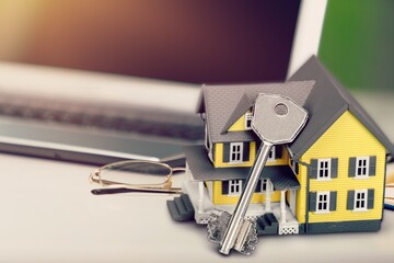 Poster - Model houses and contract documents on the desk in the office, contract about mortgage and home insurance offers