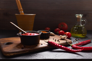 Poster - Chilly pepper and tomato sauce ingredient for homemade cooking at table. Chilli and recipe