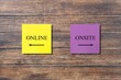 © BillionPhotos.com - Yellow and pink note on wall with text and direction to ONLINE and ONSITE, concept of education and work in pandemic lockdow
