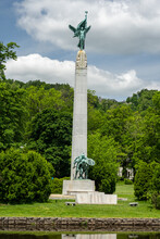 Montclair,NJ - USA - May 29, 2022 Closeup Of The Historic Memorial Obelisk At Edgemont Memorial Park. A Tall Obelisk With Bronze Sculptures Of Winged Victory On Top And The Billy Boys On The Bottom.