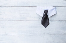 Simple Black Necktie With White Shirt Collar On Blank White Wood Background, Business And Father's Day Background Idea