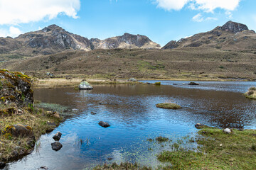 Wall Mural - Mountain lake Apicocha in Cajas National Park on sunny day, Toreadora recreation zone. South America, Ecuador, Azuay province close to Cuenca