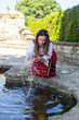 © Martin - Тhе beauty of the Bulgarian woman dressed in national costume in the sea garden of the palace of Balchik, Bulgaria