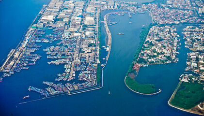 Jakarta Bay view from the airplane window that looks crowded and busy