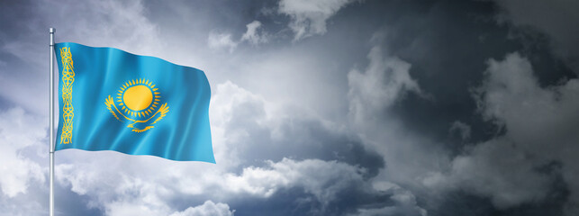 Wall Mural - Kazakhstan flag on a cloudy sky