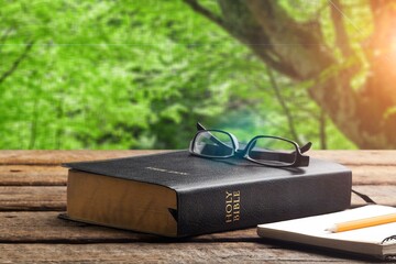 Wall Mural - double exposition with holy bible with sunset