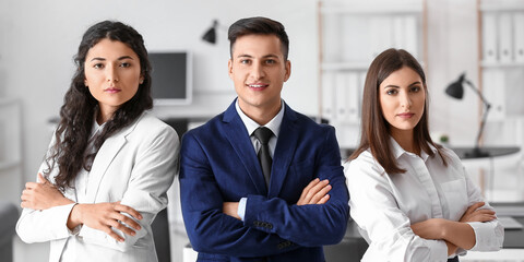 Wall Mural - Young business people with crossed arms in office