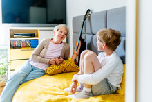 Nanny Granny Telling Story To Preschool GrandchildNanny Granny Telling Story To School Age Little Boy Grandchild At His Room At Home. Enjoying, Relations, Relaxing Carefree Leisure Weekend Hobby Activ