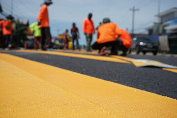 Sticker - Blurred image, paved road and yellow traffic markings