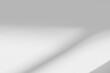 © merrymuuu - Gray window shadow and light blur abstract background on white wall, shadow overlay effect