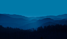 Beautiful Landscape With Blue Misty Silhouettes Of Mountains 