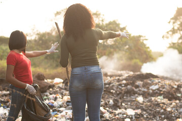 Wall Mural - african women cleaning a refuse site